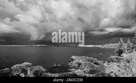 Dramatic cloud formation over Lake Superior in infrared; Thunder Bay, Ontario, Canada Stock Photo