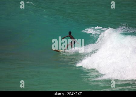 Boy surfing at Boston Bay, Port Antonio, Jamaica; Boston Bay, Port Antonio, Jamaica Stock Photo