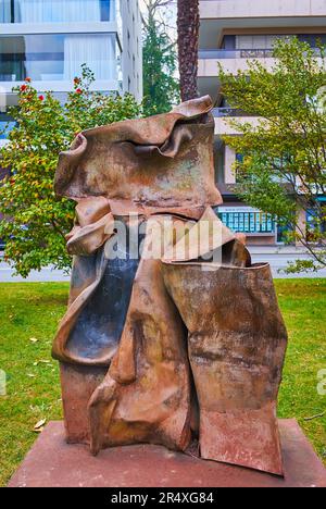 LUGANO, SWITZERLAND - MARCH 14, 2022: The modern sculptures in Park of Sculptures on embankment of Lake Lugano, Lugano, Switzerland Stock Photo