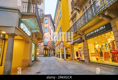 LUGANO, SWITZERLAND - MARCH 14, 2022: The  Via Pessina street of Lugano old town boasts many tourist shops and brand boutiques, Switzerland Stock Photo