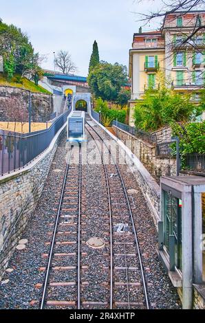 The modern wagons of Sassellina funicular (Citta-Stazione funicular), riding up and down the mountain slope in old town, Lugano, Switzerland Stock Photo