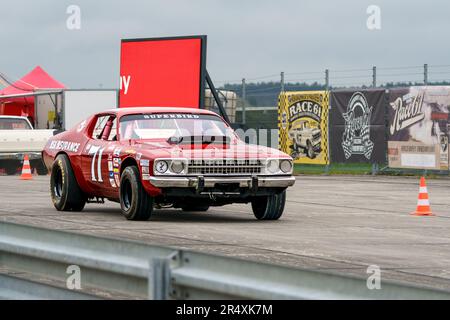 FINOWFURT, GERMANY - MAY 06, 2023: The mid-size car Plymouth Road Runner on the race track. Race festival 2023. Season opening. Stock Photo