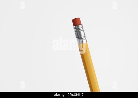 Traditional yellow pencil with a red eraser isolated on white background. Copy space for web design templates and slide show presentation Stock Photo