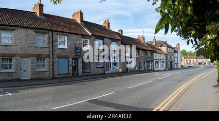 HELMSLEY, UK - MAY 29, 2023.  Landscape panorama of small independent shops in the popular tourist town of Helmsley in North Yorkshire Stock Photo