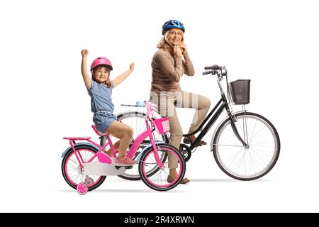 Mother and daughter with bicycles putting on helmets isolated on white background Stock Photo