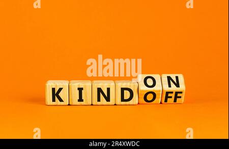 Kind on or off symbol. Businessman turns wooden cubes and changes word Kind off to Kind on. Beautiful orange table orange background. Business and kin Stock Photo