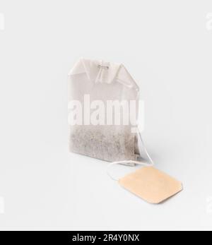 Rectangular tea bag with label isolated on white background close-up. Stock Photo