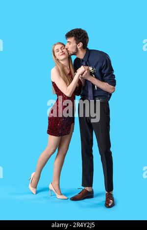 Beautiful prom couple on blue background Stock Photo