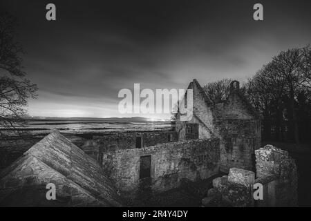 Ancient medieval stone ruins of historic 12th century church St. Bridget's at night along the seaside Fife Coastal Path in Dalgety Bay, Scotland, UK. Stock Photo