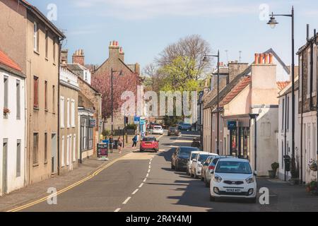 Aberdour, UK - April 21 2023: Charming and quaint high street of historic village of Aberdour, Burntisland in Fife, Scotland, UK on a sunny spring day Stock Photo