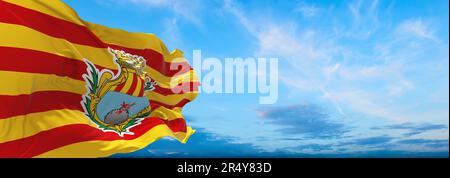 flag of Ibero-Romance peoples Algheresi at cloudy sky background, panoramic view. flag representing ethnic group or culture, regional authorities. cop Stock Photo