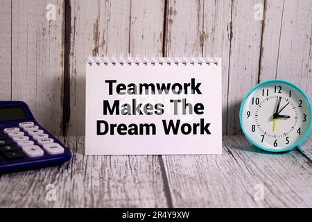 TMDW Teamwork makes dream work symbol. Concept words TMDW Teamwork makes dream work on white note on beautiful wooden background. Business TMWD teamwo Stock Photo