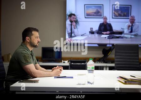 Kiev, Ukraine. 30th May, 2023. Ukrainian President Volodymyr Zelenskyy takes part in a video call with representatives of the British defense company BAE Systems from the Mariinsky Palace, May 30, 2023 in Kiev, Ukraine. Zelenskyy discussed opening a BAE Systems facility in Ukraine for repair and product of defense hardware. Credit: Pool Photo/Ukrainian Presidential Press Office/Alamy Live News Stock Photo