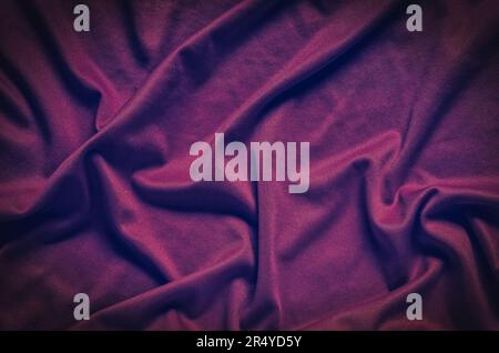 Wrinkled fabric texture. Close-up of soft cotton cloth, may be used as background. Stock Photo