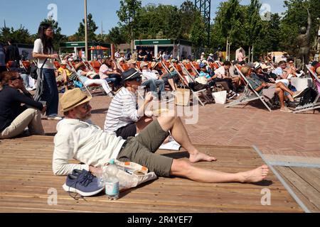 Paris, France. 30th May, 2023. Visitors relax as they watch a match on a giant screen outside the courts during the first-round tournament at Roland Garros French Tennis Open in Paris, France, on Tuesday, May 30, 2023. Photo by Maya Vidon-White/UPI Credit: UPI/Alamy Live News Stock Photo