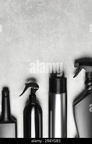 Flat lay composition with car cleaning products on light grey table ...