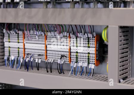 Rackmount PLC control panel wiring close up. Selective focus. Stock Photo