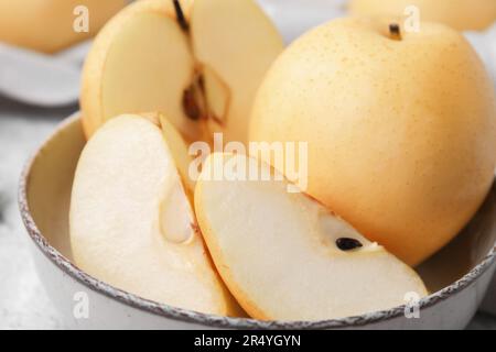Delicious fresh apple pears in bowl, closeup Stock Photo
