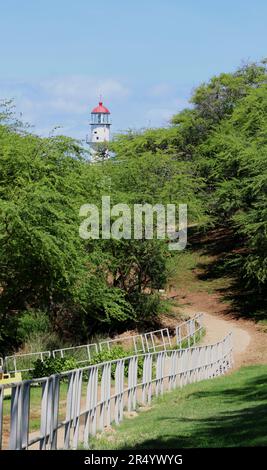 Path to the beautiful white lighthouse capped with a red dome, Diamond Head, O'ahu, Hawaii. Stock Photo