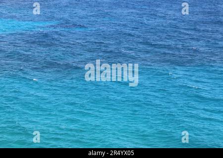 Calm ocean waters with contrasting shades of turquoise and deep blue, Oahu, HI. Stock Photo