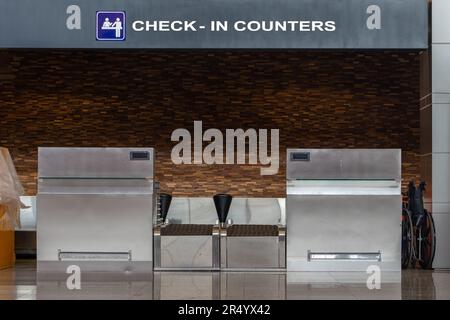 Empty check-in desk at modern airport Stock Photo - Alamy