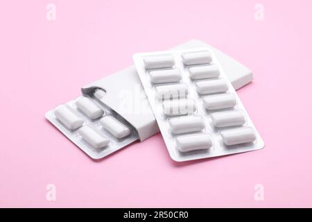 Blisters with chewing gums on pink background Stock Photo