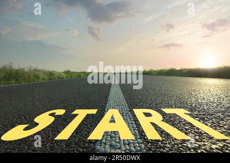 New beginnings. Word Start on asphalt road outdoors Stock Photo