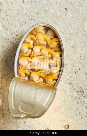 Cockles in an opened tin can Stock Photo