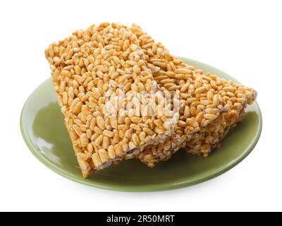 Plate with puffed rice bars (kozinaki) on white background Stock Photo