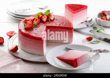 Layered strawberry cheesecake, sliced Stock Photo