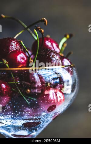 Organic sweet cherries in a champagne glass (Close Up) Stock Photo