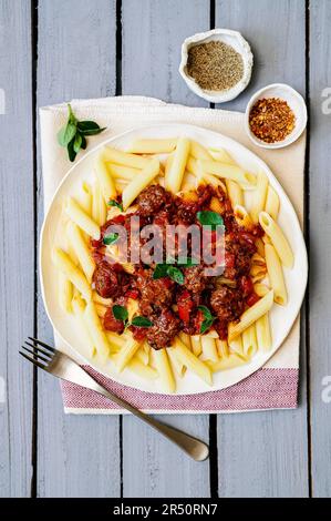 Penne with mini meatballs Stock Photo
