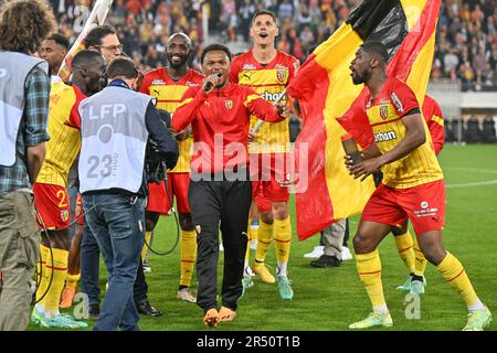 players of RC Lens and their president Joseph Oughourlian pictured  celebrating after winning and qualifying for the Champions League after a  soccer game between t Racing Club de Lens and AC Ajaccio