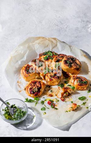 Stromboli rolls filled with pesto, tomato and mozarella cheese Stock Photo