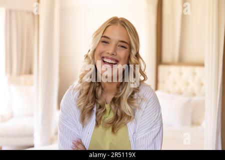 Portrait of beautiful plus size caucasian woman with blonde hair laughing and looking at camera Stock Photo