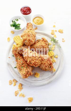 Chicken legs baked in corn flakes Stock Photo