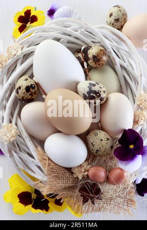 Easter composition with eggs with fresh flowers Stock Photo