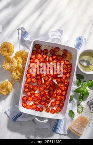Roasted cherry tomatoes in a casserole dish Stock Photo