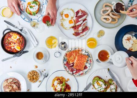 Richly set breakfast table Stock Photo