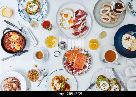 Richly set breakfast table Stock Photo