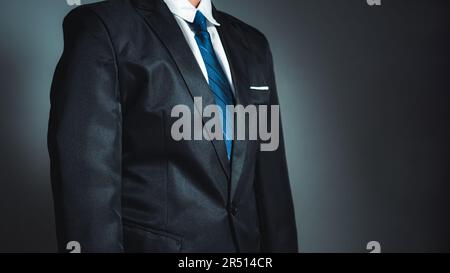 businessman standing on dark gradient background. business concept. suit. Stock Photo