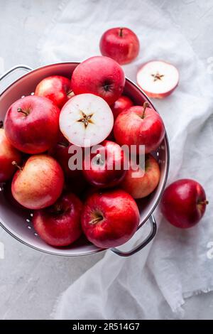 Fresh red apples in a colander Stock Photo