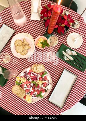 Festive table setting with beetroot and salmon platter and crackers Stock Photo