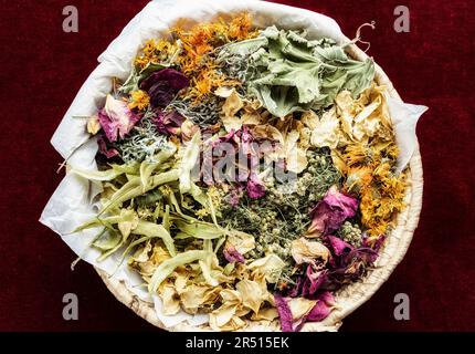 Various dried medicinal herbs in a basket Stock Photo