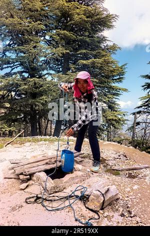 Drawing water from a cistern while trekking the Lycian Way, Turkey Stock Photo