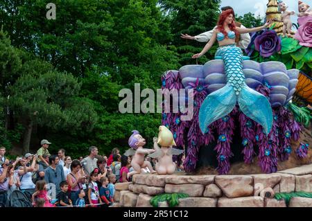 Paris, France, Theme Parks, People Visiting Disneyland Paris, Employee in Character Costume Entertaining Large Crowd at Disney Parade, adults Stock Photo