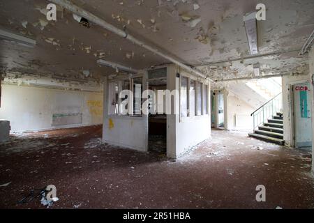 The building is vast but has all been left to decay. MILLISLE, NORTHERN IRELAND: THIS ABANDONED juvenile prison housed young boys who were in for crim Stock Photo