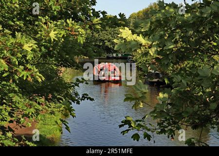 The fuel boat is coming “Ambush” a Leeds and Liverpool long boat, approaches the turn in Parbold on the Leeds and Liverpool canal in West Lancashire. Stock Photo