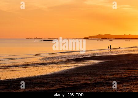Sunset on Rhosneigr beach, Anglesey, Wales, UK Stock Photo