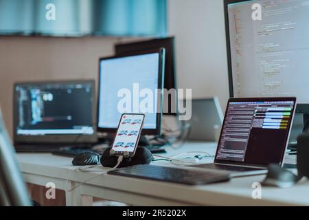 Computer screens running programming code in empty software developing agency office and computers parsing data algorithms in background. Neural Stock Photo